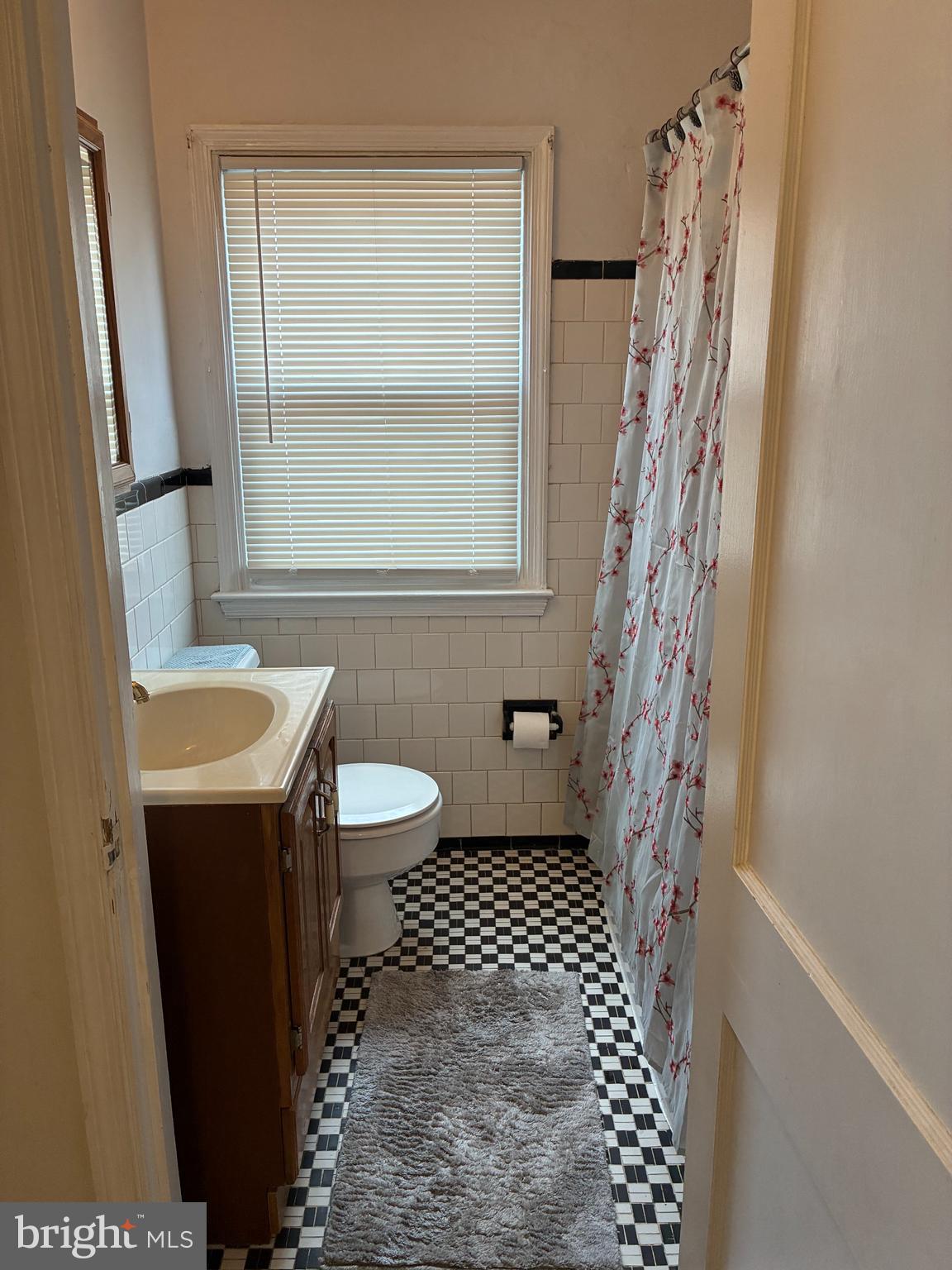 538 47th Street Baltimore, MD 21224 - Photo 12 of 20 a bathroom with a sink toilet and shower