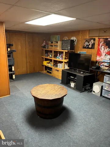 a room with furniture and a flat screen tv