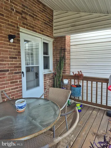 a view of a deck with chair and table