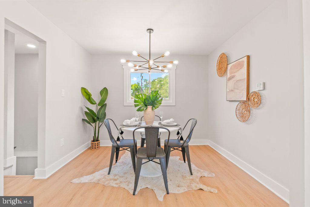 3500 Edwards Street Lanham, MD 20706 - Photo 11 of 40 a view of a dining room with furniture and a chandelier