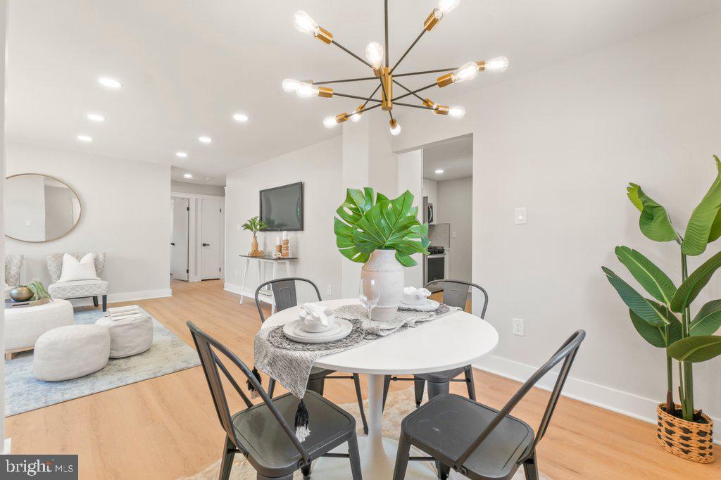3500 Edwards Street Lanham, MD 20706 - Photo 12 of 40 a view of a dining room with furniture and a potted plant