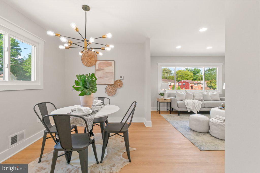 3500 Edwards Street Lanham, MD 20706 - Photo 13 of 40 a view of a dining room with furniture a chandelier and a window