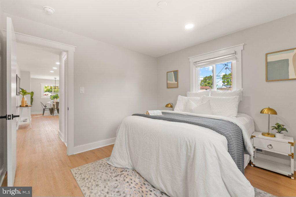 3500 Edwards Street Lanham, MD 20706 - Photo 21 of 40 a bedroom with a bed and wooden floor