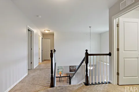 a view of a hallway with staircase