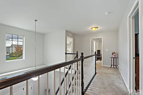 a view of a hallway with windows