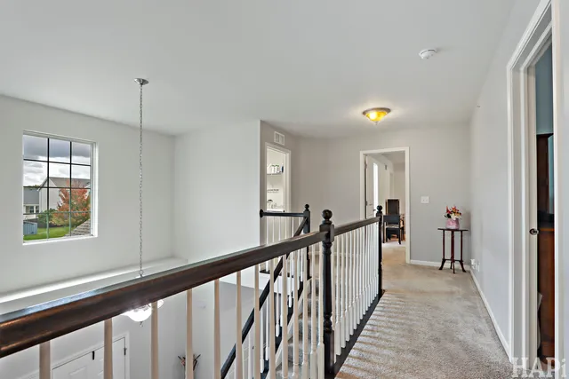 a view of a hallway with windows