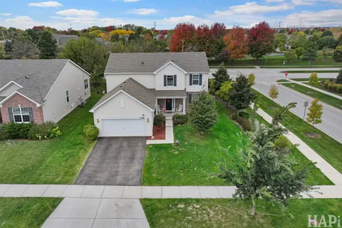 aerial view of a house with a yard