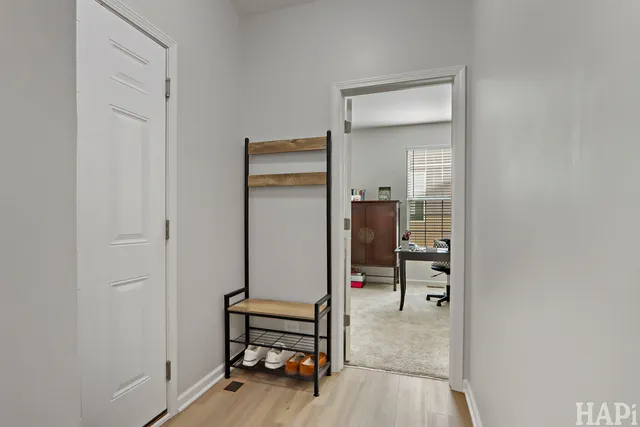 a view of kitchen with furniture and wooden floor