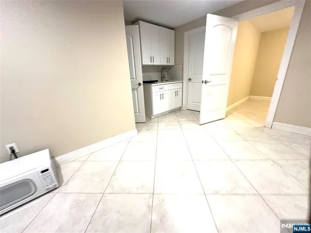 a kitchen with stainless steel appliances cabinets a sink and a counter top space