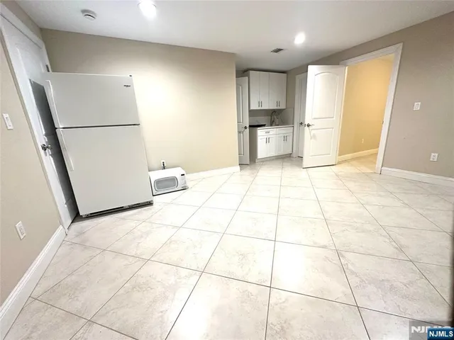 a bathroom with a sink a toilet a mirror and vanity