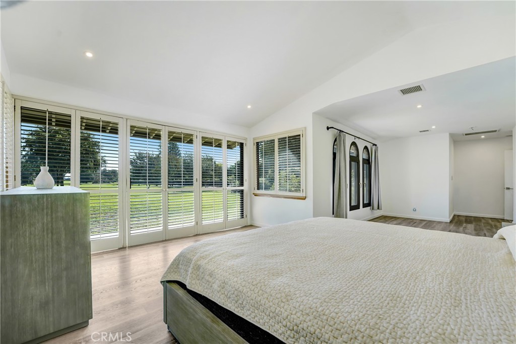 127 East Roses Road San Gabriel, CA 91775 - Photo 13 of 29 a bed sitting in a spacious bedroom next to a large window