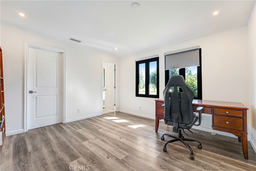 127 East Roses Road San Gabriel, CA 91775 - Photo 18 of 29 a view of a workspace with furniture and a window