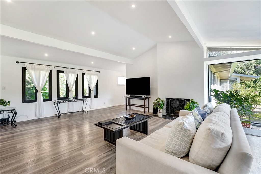 127 East Roses Road San Gabriel, CA 91775 - Photo 4 of 29 a living room with furniture wooden floor and a large window