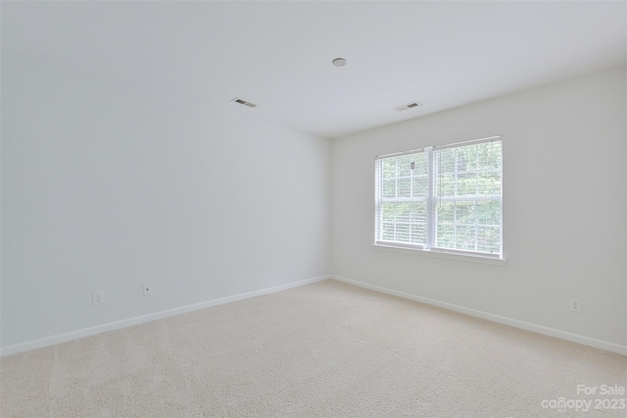 6912 Reedy Creek Road Charlotte, NC 28215 - Photo 33 of 43 an empty room with a window