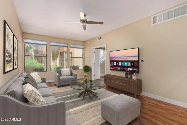 a living room with furniture and a flat screen tv