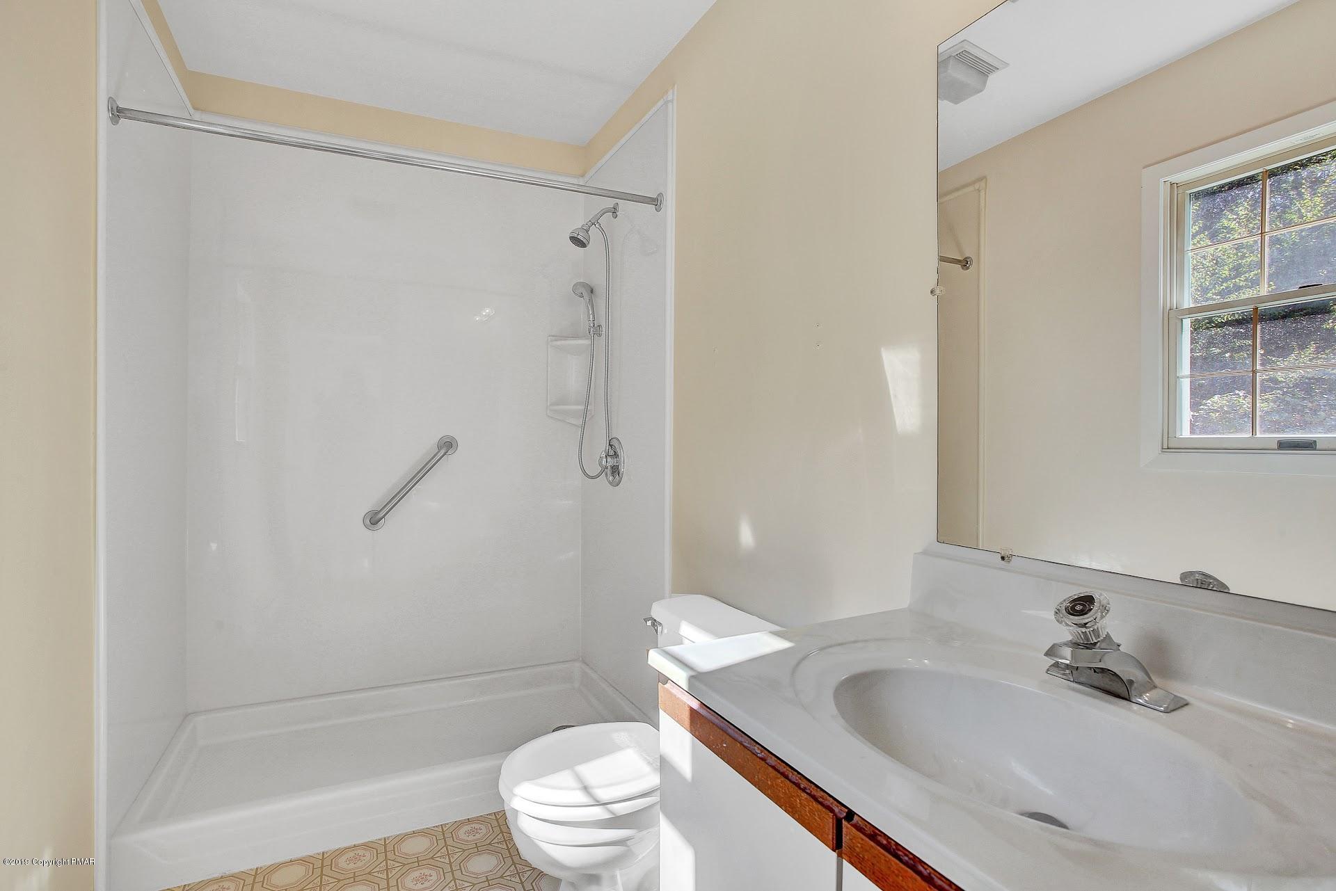 295 Sundance Road Effort, PA 18330 - Photo 12 of 25 a bathroom with a sink toilet and shower