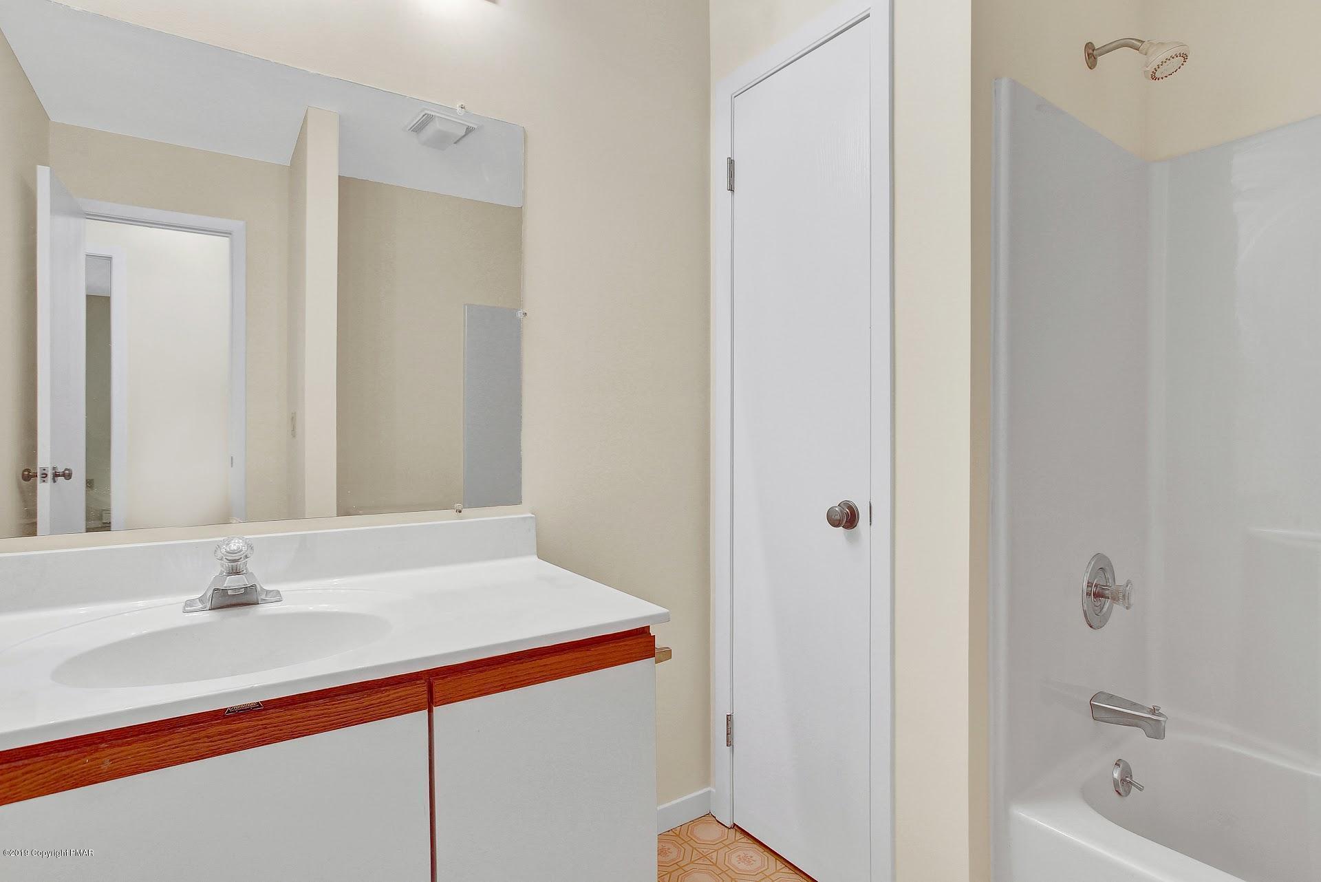 295 Sundance Road Effort, PA 18330 - Photo 15 of 25 a bathroom with a sink and a bathtub