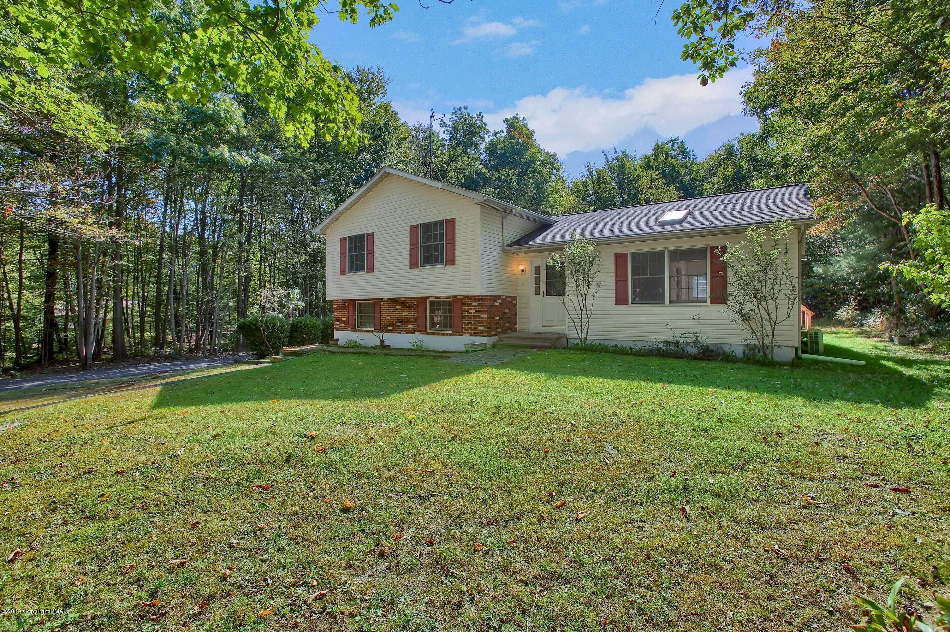 295 Sundance Road Effort, PA 18330 - Photo 2 of 25 a view of a house with yard and a garden