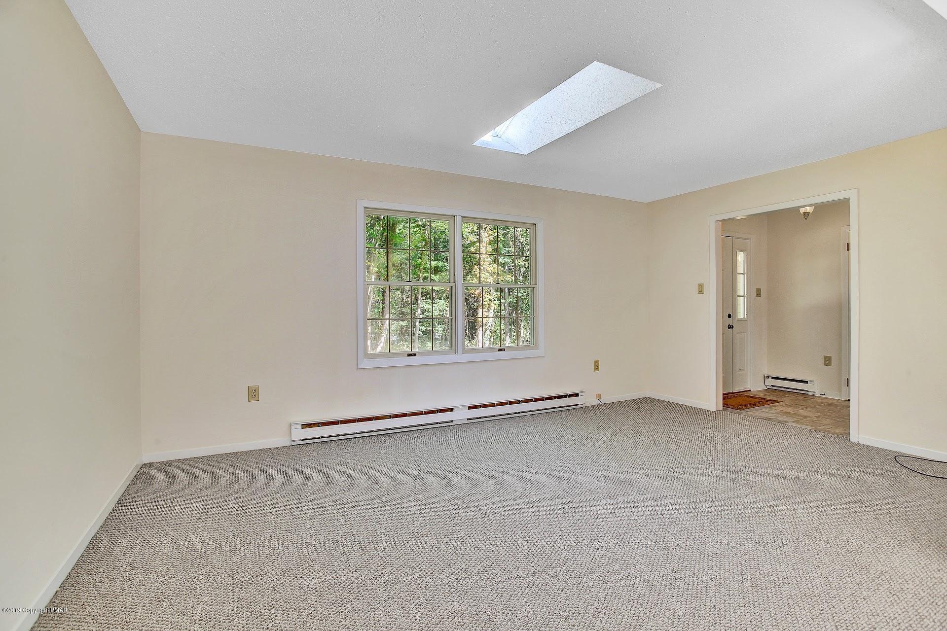 295 Sundance Road Effort, PA 18330 - Photo 4 of 25 an empty room with windows