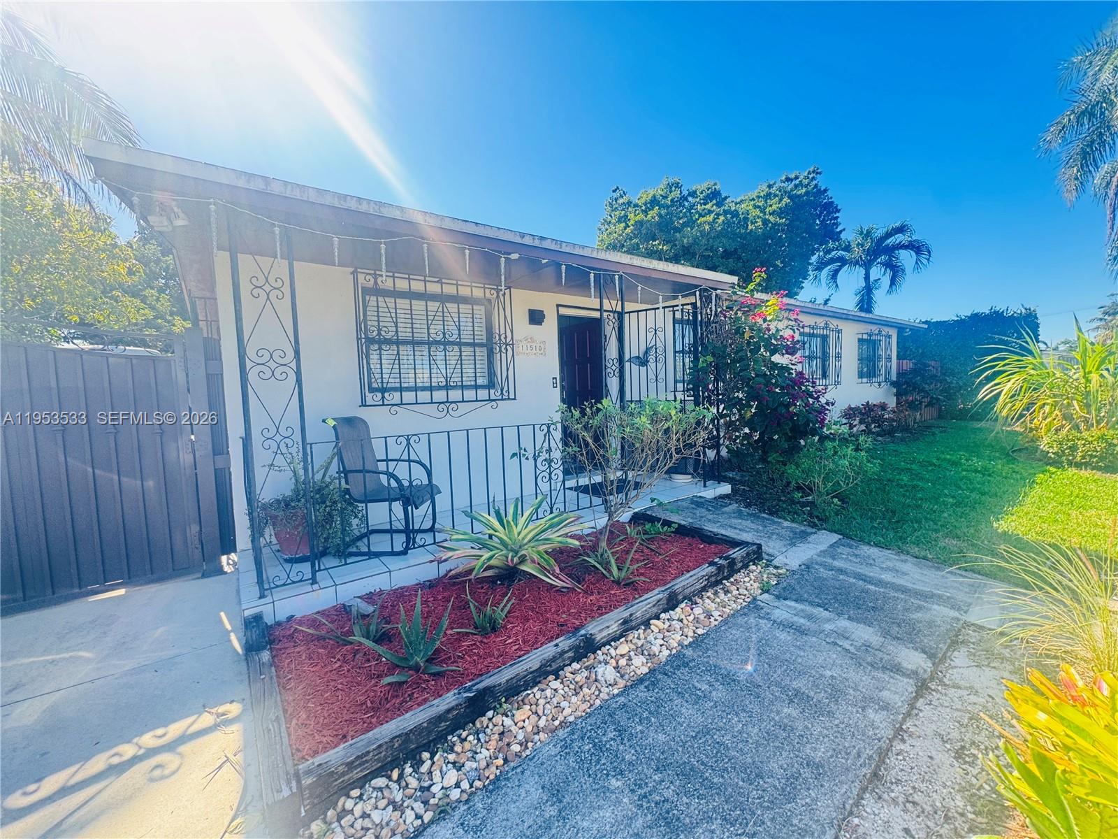 11510 Southwest 191st Terrace Miami, FL 33157 - Photo 2 of 15 a view of a backyard with plants and a patio