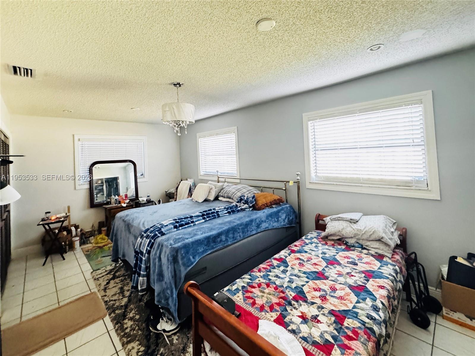 11510 Southwest 191st Terrace Miami, FL 33157 - Photo 7 of 15 a bedroom with bed and a window