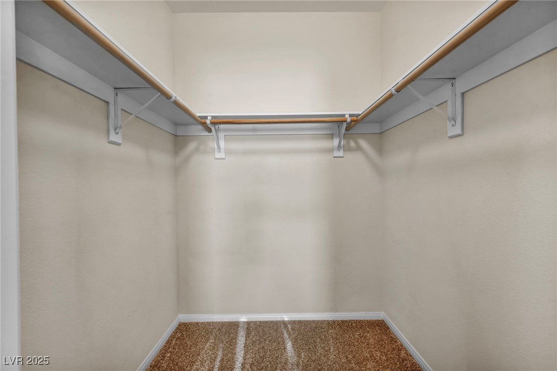 10550 West Alexander Road, Unit 2103 Las Vegas, NV 89129 - Photo 24 of 45 Walk in closet with carpet floors