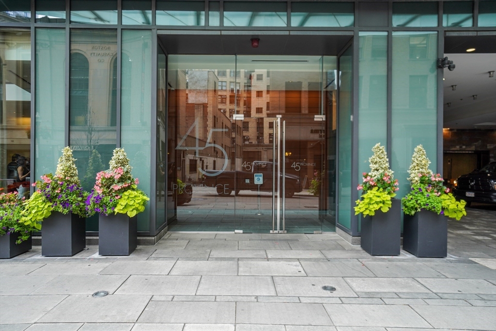 45 Province Street, Unit 1903 Boston, MA 02108 - Photo 11 of 31 a flower pot with a table and potted plants