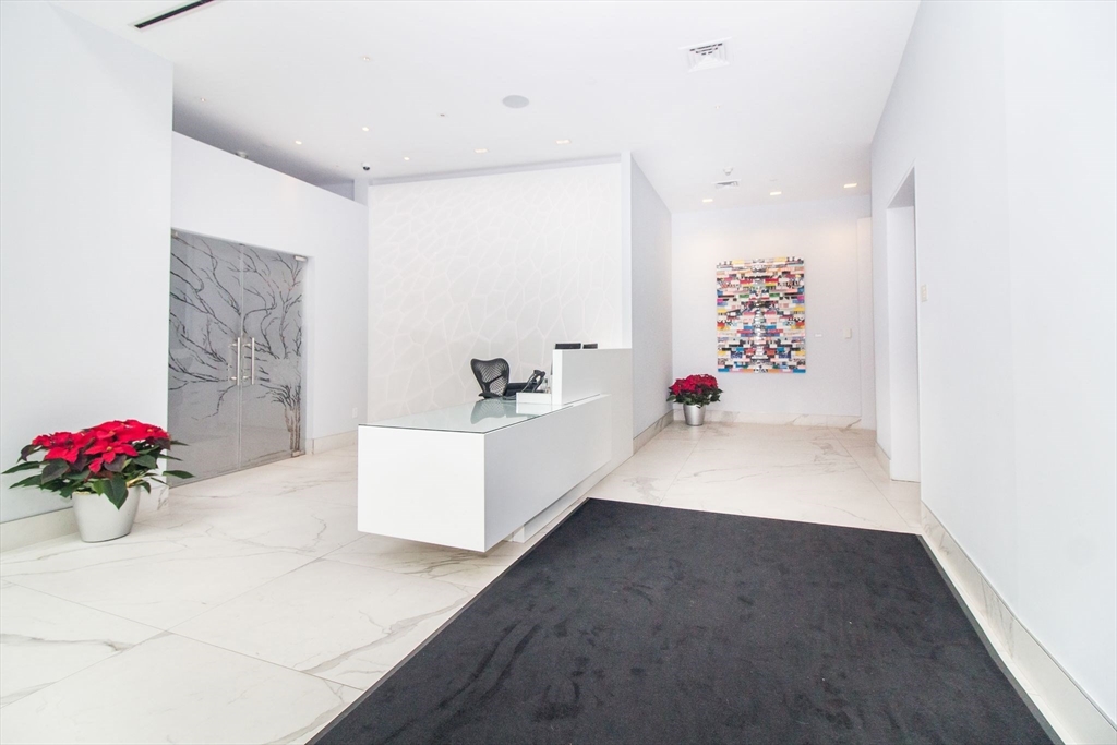45 Province Street, Unit 1903 Boston, MA 02108 - Photo 15 of 31 a bathroom with a tub sink mirror and vanity