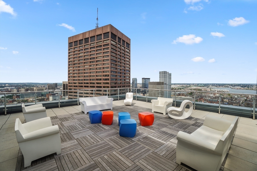 45 Province Street, Unit 1903 Boston, MA 02108 - Photo 27 of 31 a view of a roof deck with couches and potted plants