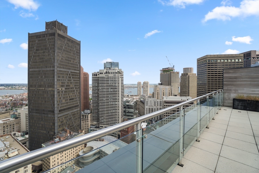 45 Province Street, Unit 1903 Boston, MA 02108 - Photo 29 of 31 a city view with tall buildings
