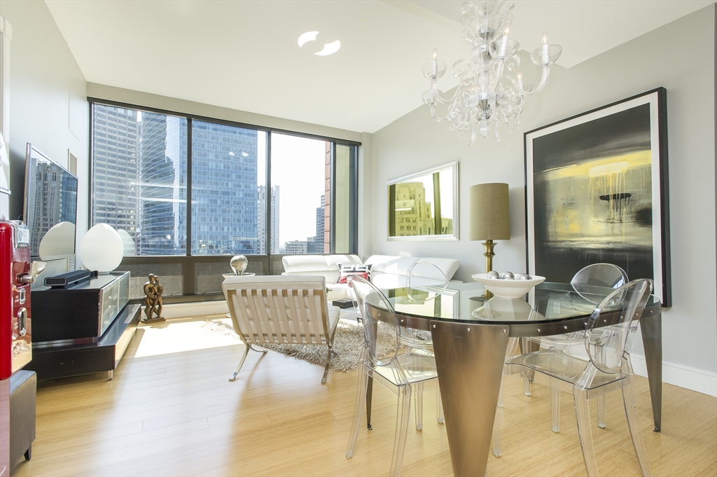 45 Province Street, Unit 1903 Boston, MA 02108 - Photo 5 of 31 a living room with furniture and a large window