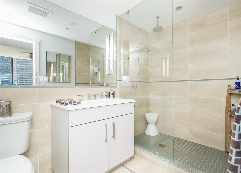 45 Province Street, Unit 1903 Boston, MA 02108 - Photo 7 of 31 a bathroom with a toilet sink and a shower
