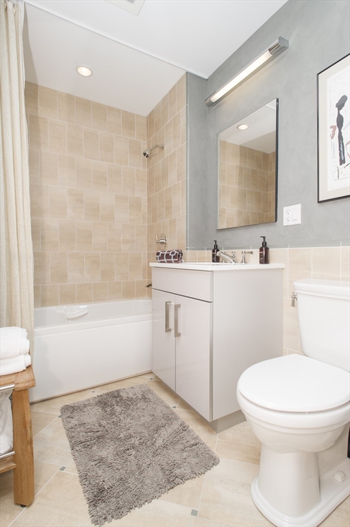 45 Province Street, Unit 1903 Boston, MA 02108 - Photo 9 of 31 a bathroom with a sink a toilet and shower