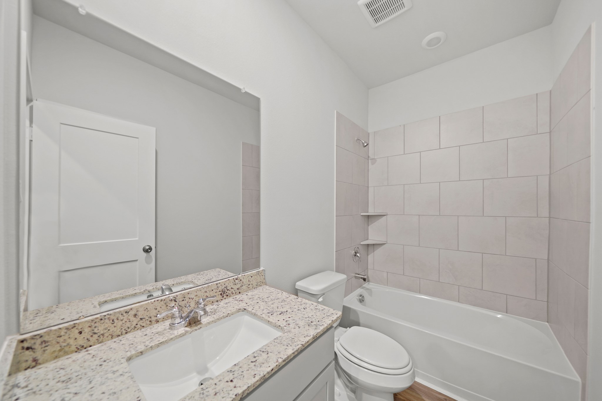 537 Wax Myrtle Way Hockley, TX 77447 - Photo 5 of 21 a bathroom with a granite countertop sink a toilet and bathtub