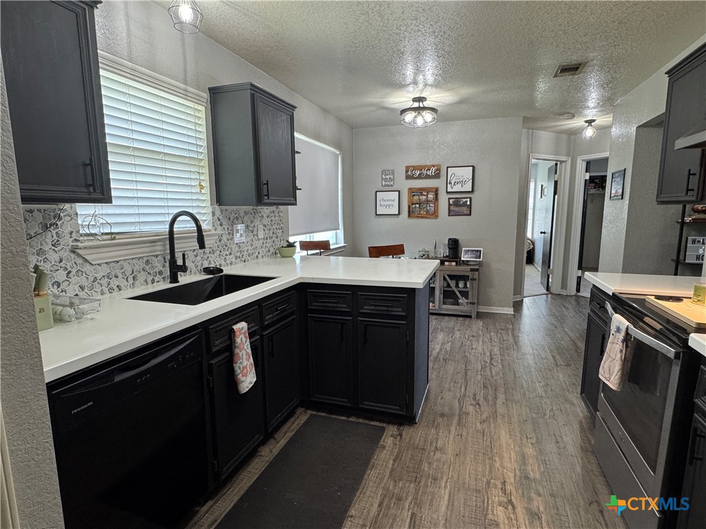 1817 Dusk Drive Killeen, TX 76543 - Photo 12 of 23 a kitchen with a sink appliances and cabinets