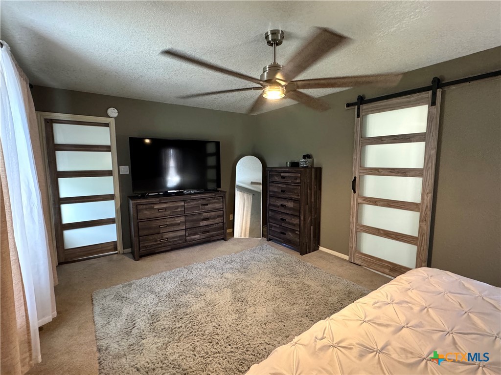 1817 Dusk Drive Killeen, TX 76543 - Photo 20 of 23 a bedroom with a bed and a large window