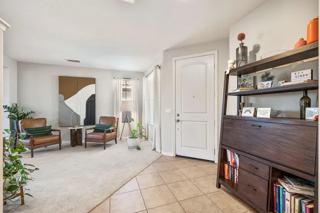 a kitchen with stainless steel appliances kitchen island granite countertop a refrigerator and a stove top oven