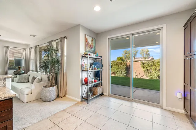 a bedroom with furniture and a chandelier