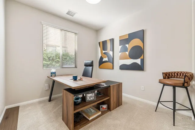 a bathroom with a tub shower vanity and a sink