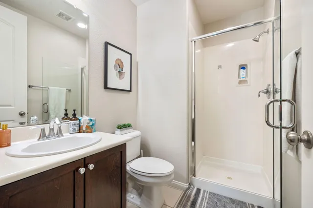 a en suite bathroom with a tub sink and view bedroom