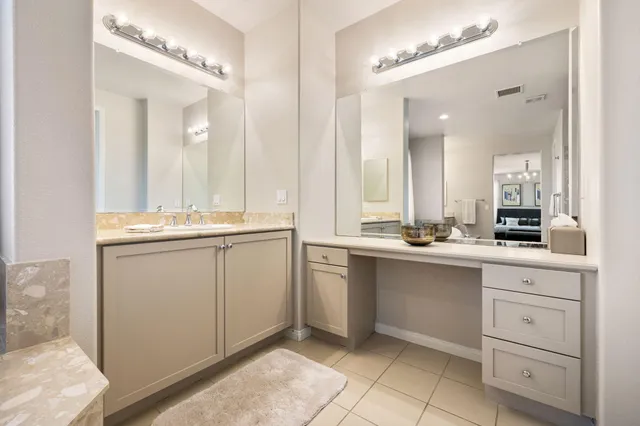 a kitchen that has a sink and a stove in it