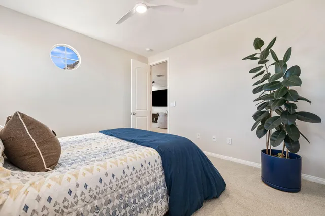a view of a porch with furniture and a yard