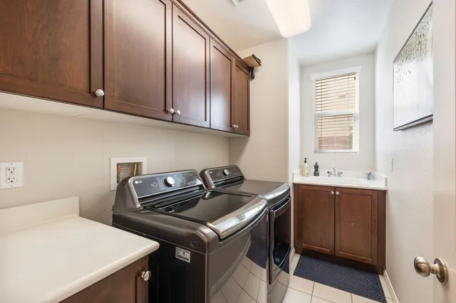 a view of a brick wall with plants