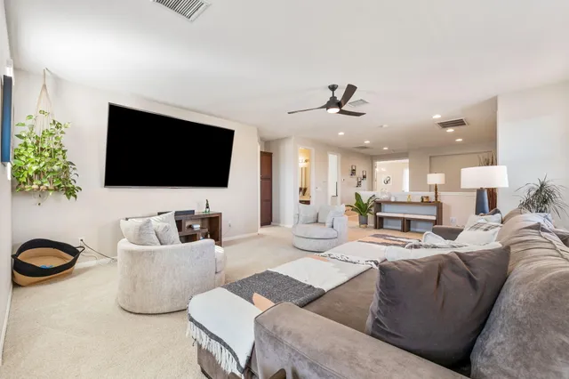 a large bathroom with a granite countertop tub a sink and a large window