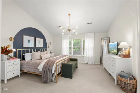 a bedroom with bed and window