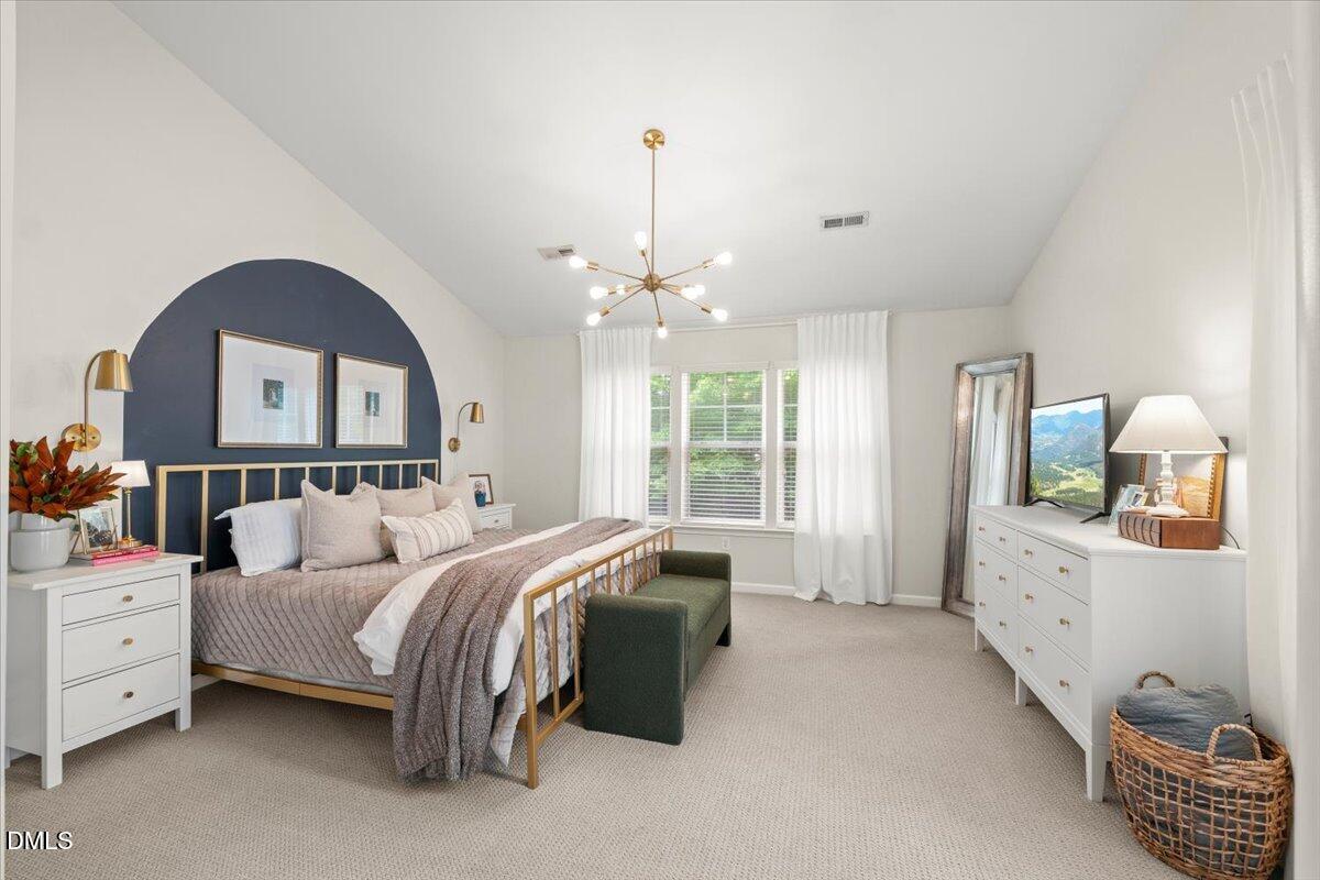 8449 Central Drive Raleigh, NC 27613 - Photo 22 of 38 a bedroom with bed and window