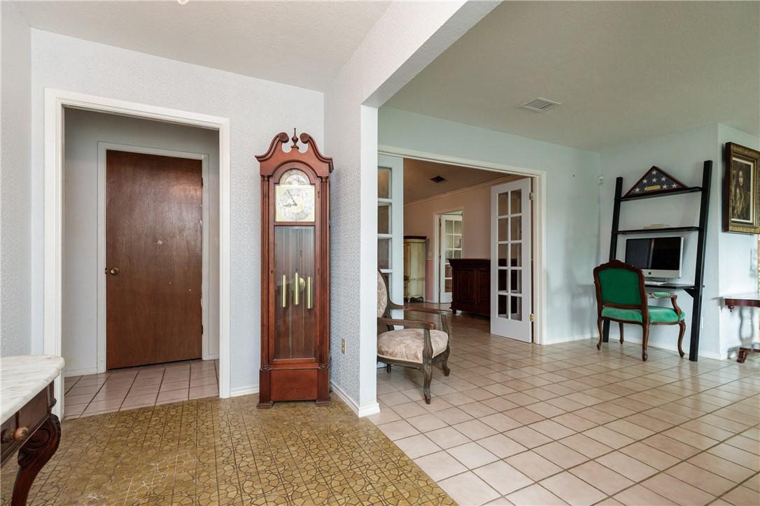4401 Bluefield Drive Corpus Christi, TX 78413 - Photo 12 of 25 a living room with furniture and a fireplace