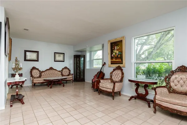 a living room with furniture and a window
