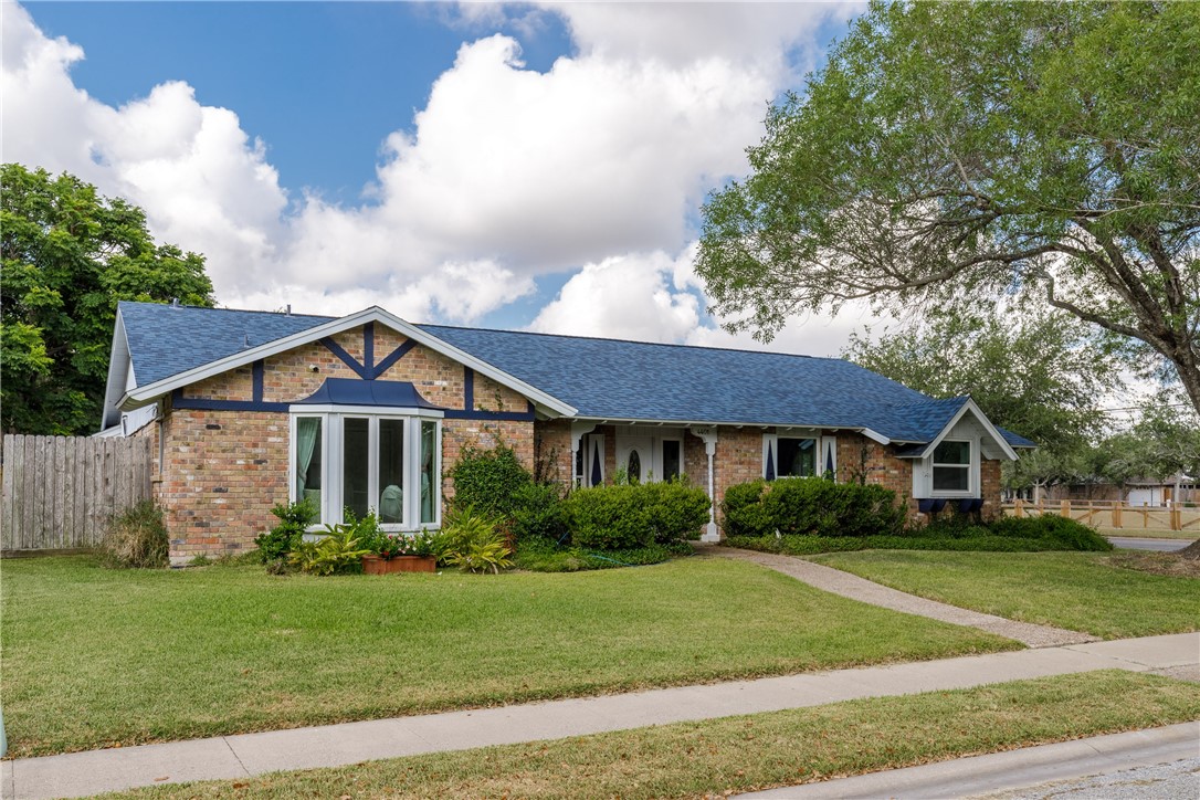 4401 Bluefield Drive Corpus Christi, TX 78413 - Photo 3 of 25 a front view of a house with a yard