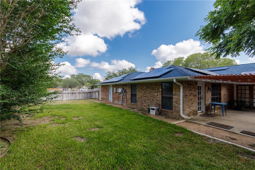 4401 Bluefield Drive Corpus Christi, TX 78413 - Photo 4 of 25 a view of a chair and table in backyard of the house